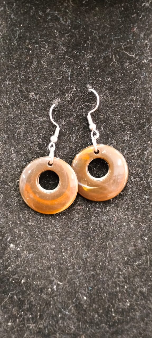 Brown round earing